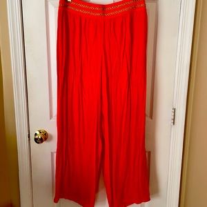 Orange color wide leg pants.